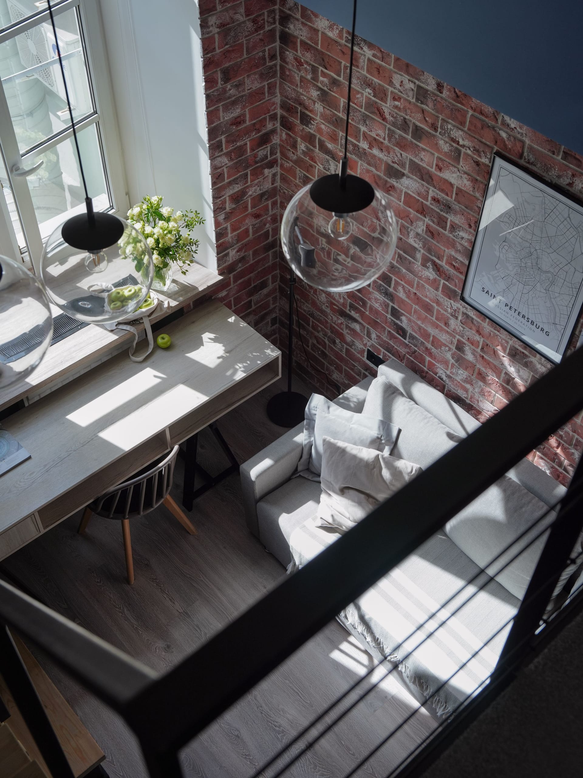 Bright home interior with black steel-framed glass wall